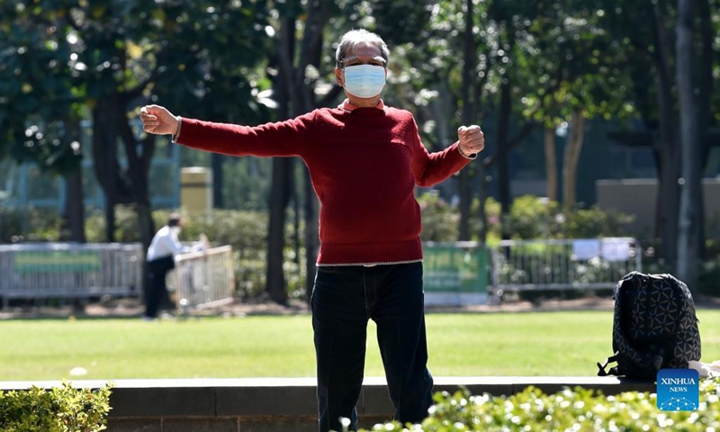 A man wearing a face mask works out at Victoria Park in Hong Kong, south China, March 8, 2022. The Hong Kong Special Administrative Region (HKSAR) reported 28,475 new COVID-19 cases on March 8. (Xinhua/Lo Ping Fai)