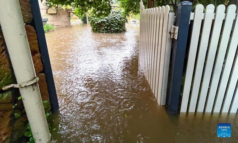 A flooded property is seen in Windsor, New South Wales, Australia on March 8, 2022. Flash floods, wild winds and storms are continuing to lash Australia's east coast, causing hundreds of people to flee their ruined homes and killing at least 13 people in the state of Queensland and seven in New South Wales.(Photo: Xinhua)
