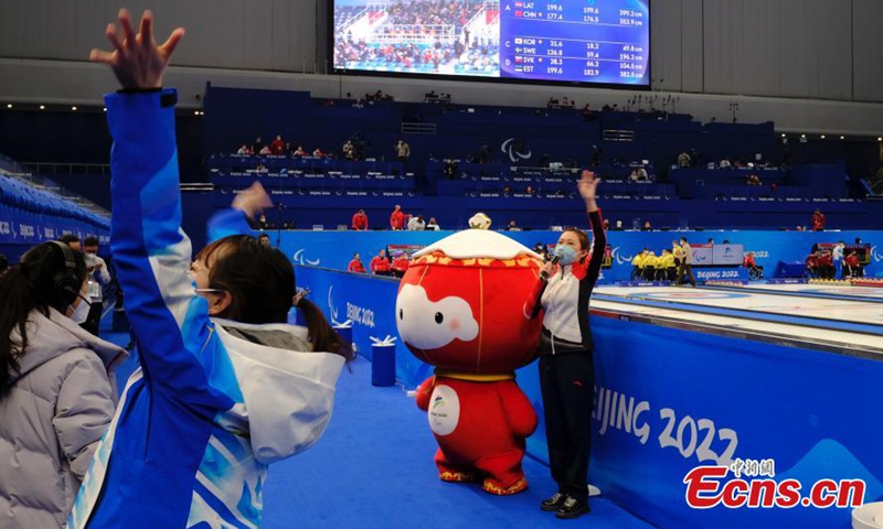 Shuey Rhon Rhon, the red lantern-shaped mascot of Beijing 2022 Winter Paralympic Games, appears at the National Aquatics Center, also known as the Ice Cube, venue of wheelchair curling competition of the Games in Beijing, March 10, 2022.Photo:China News Service