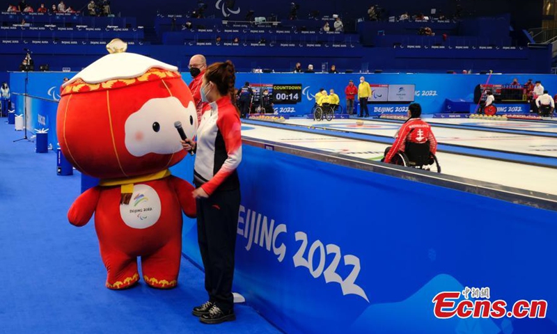 Shuey Rhon Rhon, the red lantern-shaped mascot of Beijing 2022 Winter Paralympic Games, appears at the National Aquatics Center, also known as the Ice Cube, venue of wheelchair curling competition of the Games in Beijing, March 10, 2022.Photo:China News Service