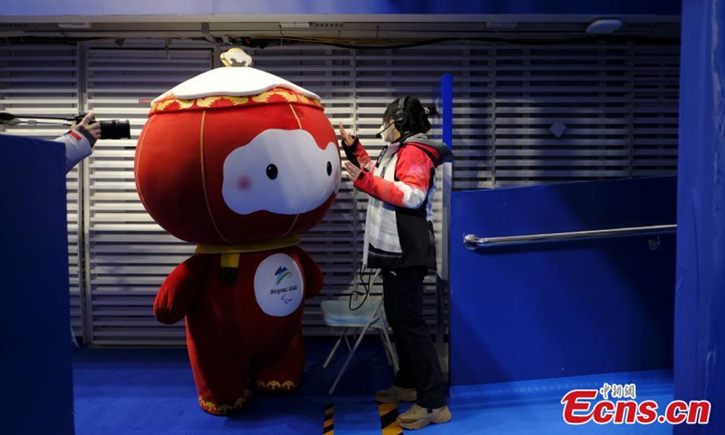 Shuey Rhon Rhon, the red lantern-shaped mascot of Beijing 2022 Winter Paralympic Games, appears at the National Aquatics Center, also known as the Ice Cube, venue of wheelchair curling competition of the Games in Beijing, March 10, 2022. Photo:China News Service