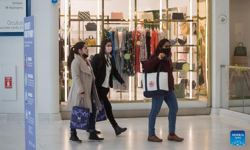 People pass stores in the Westfield shopping mall at the Oculus in New York, the United States, on March 10, 2022.US consumer inflation in February continued to rise at the fastest annual pace in 40 years, the US Labor Department reported on Thursday.