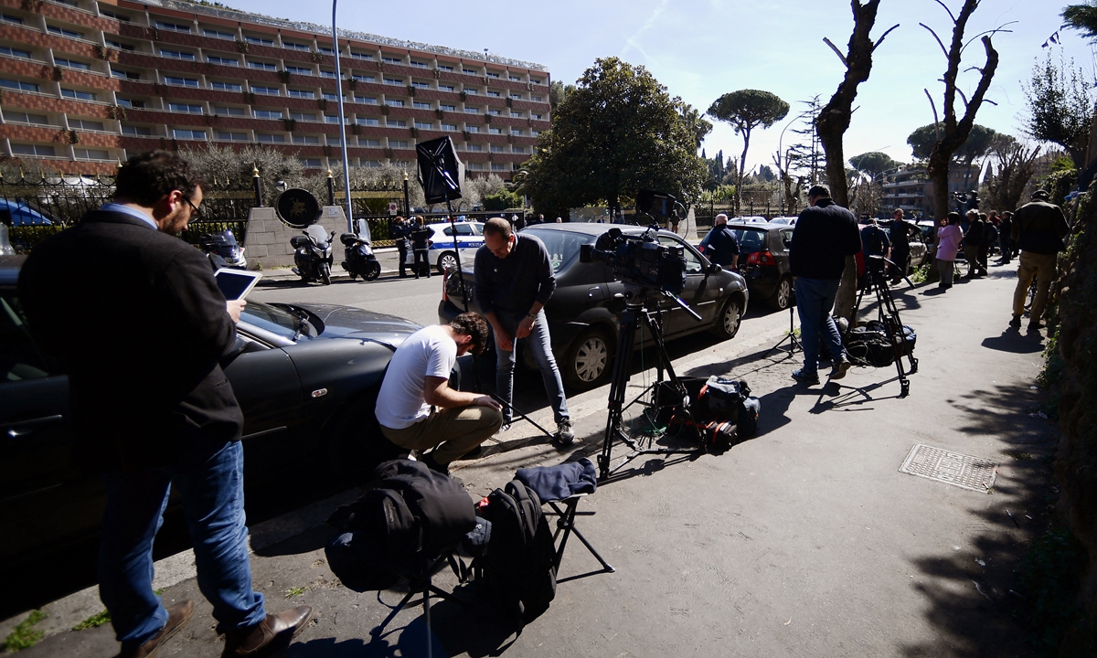 Journalists wait outside the Cavalieri Waldfor Astoria hotel in Rome on local time March 14, 2022 where China's top diplomat Yang Jiechi was scheduled to meet US president's national security advisor Jake Sullivan. Photo: AFP
