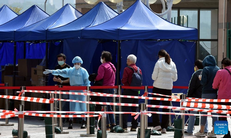 People queue up for COVID-19 tests at Tsing Yi mobile test site in Hong Kong, south China, Feb 27, 2022. Photo:Xinhua