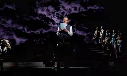 Wang Jiannan, director of <em>Spring Tide</em>, holds the script Screenshot on stage at National Center for Performing Arts in Beijing on MArch 12, 2022.Photo: screenshot from The Paper