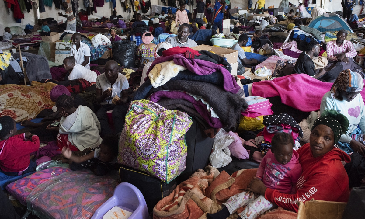 One part of a group of about 630 refugees stay inside a large tent in Bellville, South Africa on September 22, 2020. Photos: AFP