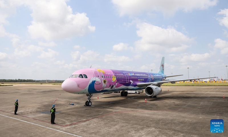 A plane painted with patterns of the China International Consumer Products Expo arrives at Meilan International Airport in Haikou, south China's Hainan Province, March 13, 2022. China Southern Airlines' aircraft themed with International Consumer Products Expo arrived in Haikou on Sunday, completing its maiden flight. (Xinhua/Zhang Liyun)