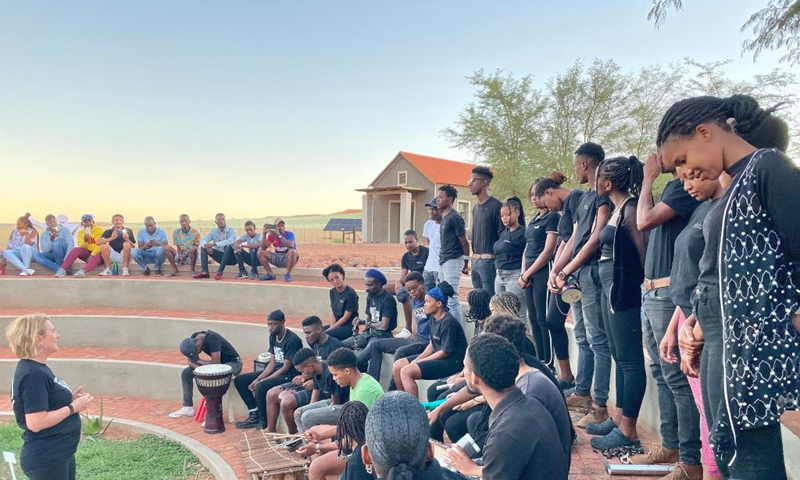 Participants sing during the Hit the Beat event at Wolwedans Village, located in the desert plains of the NamibRand Nature Reserve in Namibia on March 12, 2022. Young talented individuals from diverse cultures of the world engaged in artistic creativity during the annual Hit the Beat event at Wolwedans Village. (Photo by Musa Zimunya/Xinhua)