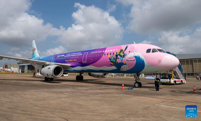 A plane painted with patterns of the China International Consumer Products Expo arrives at Meilan International Airport in Haikou, south China's Hainan Province, March 13, 2022. China Southern Airlines' aircraft themed with International Consumer Products Expo arrived in Haikou on Sunday, completing its maiden flight. (Xinhua/Hu Zhixuan)