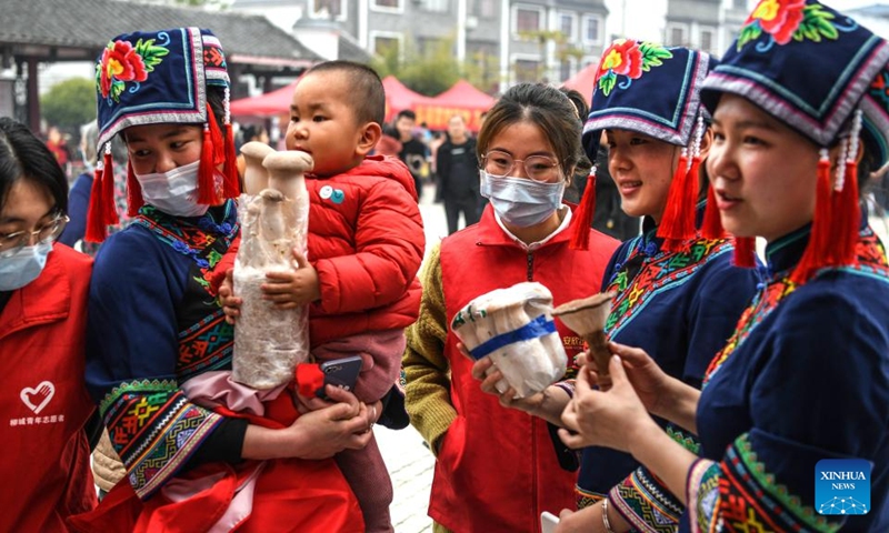 Women of Mulao ethnic group select mushrooms in Liucheng County, south China's Guangxi Zhuang Autonomous Region, March 11, 2022. (Xinhua/Zhang Ailin)