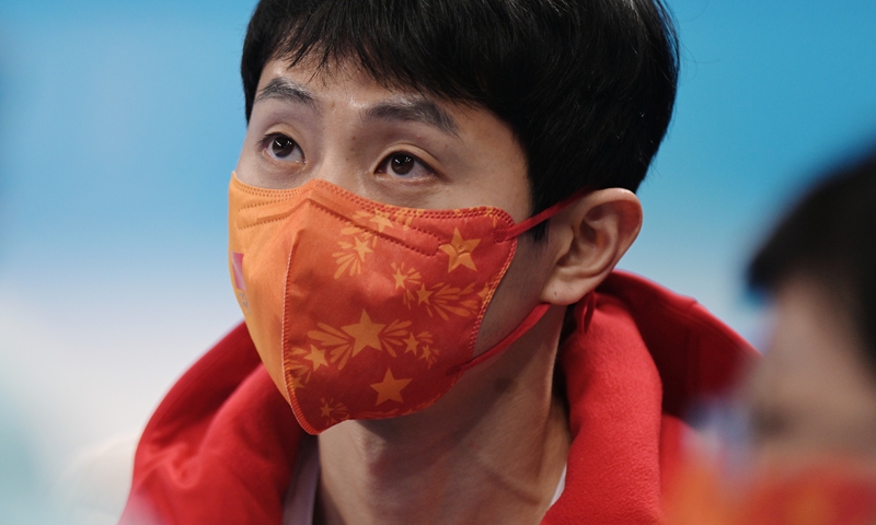 Coach of China's national short track speed skating team, Viktor Ahn wearing a protective face mask looks on ahead of the short track speed skating event during the Beijing 2022 Winter Olympic Games at Capital Indoor Stadium in Beijing, China on February 5, 2022. Photo: VCG