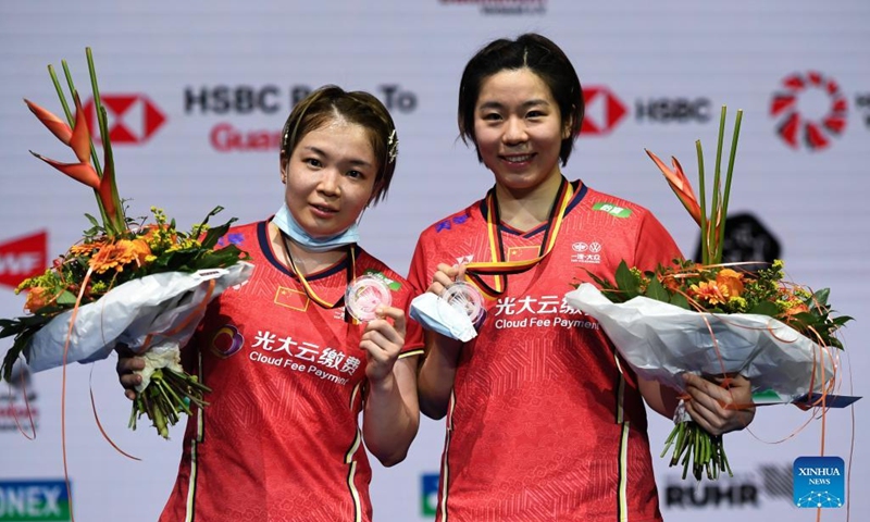 Chen Qingchen(L)/Jia Yifan of China attend the medal ceremony after winning the women's doubles final match against Gabriela Stoeva/Stefani Stoeva of Bulgaria at the Yonex German Open 2022 badminton tournament in Muelheim, Germany, March 13, 2022. (Xinhua/Lu Yang)