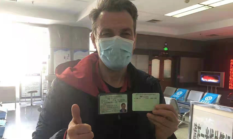 A Serbian citizen receives his driving license at the Beijing Traffic Management Bureau on March 14, 2022. Photo: Courtesy of the Serbian Embassy in Beijing