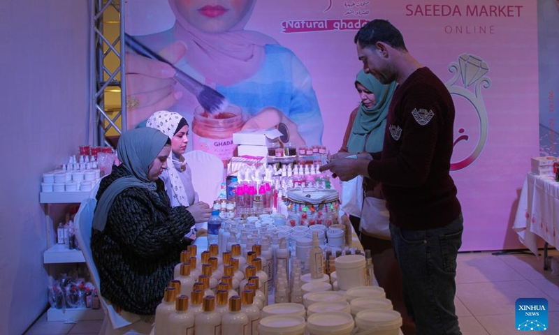 People visit the Your Wedding exhibition which features wedding supplies in Gaza City, March 14, 2022. (Photo by Rizek Abdeljawad/Xinhua)