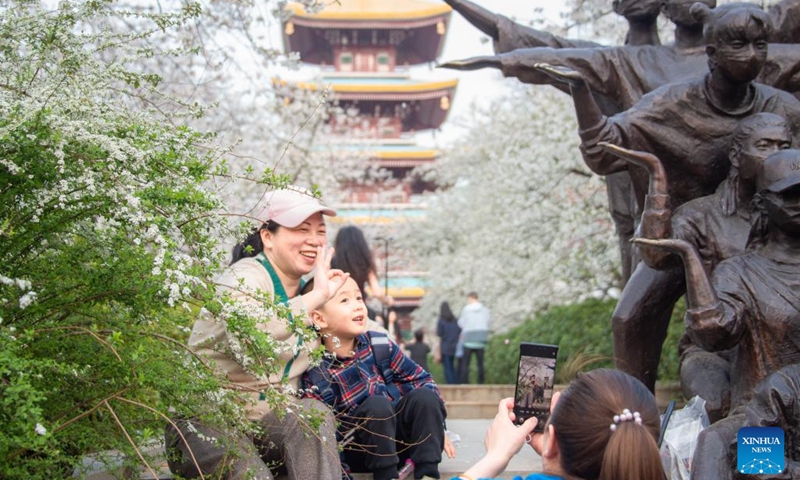 Tourists enjoy themselves at a cherry garden in Wuhan, central China's Hubei Province, March 14, 2022.(Photo: Xinhua)