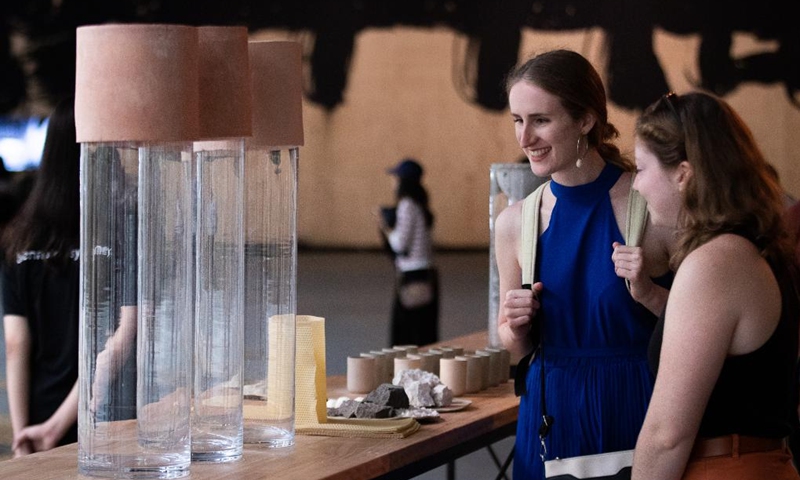 People visit Biennale of Sydney rivus at Art Gallery of New South Wales (NSW) in Sydney, Australia, on March 13, 2022. The 23rd Biennale of Sydney is held from March 12 to June 13, with more than 330 artworks by over 80 participants presented during the event. (Photo by Hu Jingchen/Xinhua)