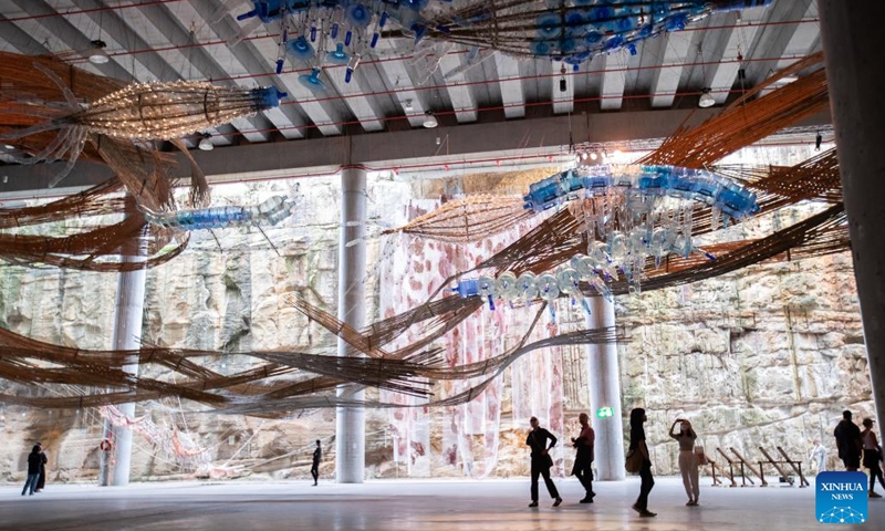 People visit Biennale of Sydney rivus at Art Gallery of New South Wales (NSW) in Sydney, Australia, on March 13, 2022. The 23rd Biennale of Sydney is held from March 12 to June 13, with more than 330 artworks by over 80 participants presented during the event. (Photo by Hu Jingchen/Xinhua)