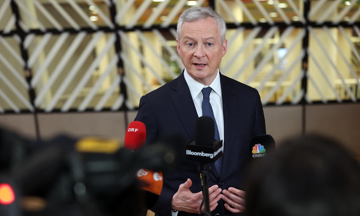 Bruno Le Maire, French Minister of Economy and Finance, talks to press before the Economic and Financial Affairs Council (ECOFIN) meeting in Brussels, Belgium on March 15, 2022. Ministers are scheduled to discuss the economic and financial consequences of the sanctions imposed on Russia over Ukraine crisis. Photo: AFP