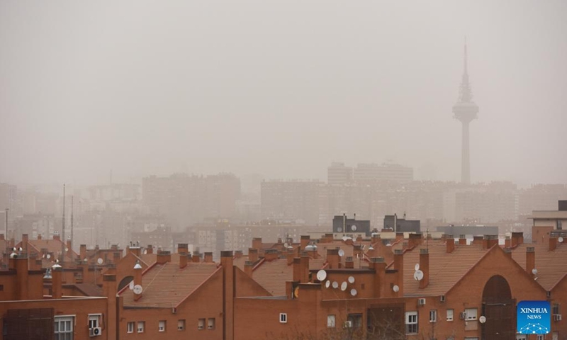 Photo taken on March 15, 2022 shows a part of the city in the sandy wind in Madrid, Spain. Storm Celia blew sand from the Sahara desert over Madrid on Tuesday. (Photo by Gustavo Valiente/Xinhua)