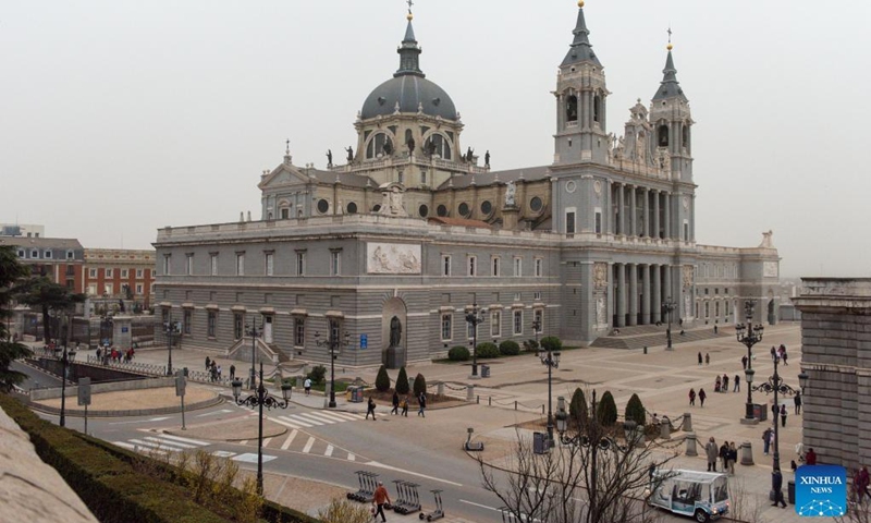 Photo taken on March 15, 2022 shows the Almudena Cathedral in Madrid, Spain. Storm Celia blew sand from the Sahara desert over Madrid on Tuesday. (Photo by Gustavo Valiente/Xinhua)