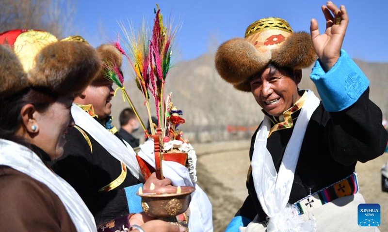 Villagers participate in a ceremony marking the start of spring farming in Changzhug Township of Shannan, southwest China's Tibet Autonomous Region, March 16, 2022. The annual spring farming ceremony was held in Tibet on Wednesday to pray for a bumper harvest of the year.(Photo: Xinhua)