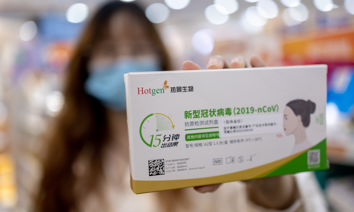 A person in Chengdu, Southwest China’s Sichuan Province shows a COVID-19 antigen test at a local pharmacy on March 17, 2022. The city’s first batch of COVID-19 antigen test kits arrived at the pharmacy on the day. Results can be obtained in about 15 minutes. Photo: VCG