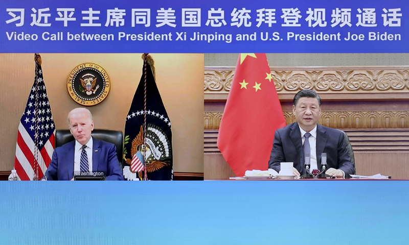 Chinese President Xi Jinping speaks with US President Joe Biden in a video meeting on Friday.Photo: Xinhua