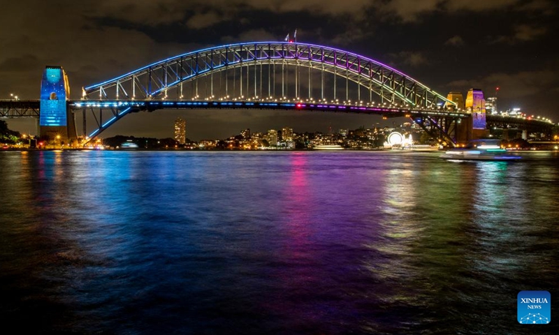 Photo taken on March 18, 2022 shows vivid light on Harbour Bridge in Sydney, Australia, as part of the Sydney Harbour Bridge 90th anniversary celebration.Photo:Xinhua