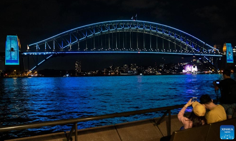 Photo taken on March 18, 2022 shows vivid light on Harbour Bridge in Sydney, Australia, as part of the Sydney Harbour Bridge 90th anniversary celebration. To mark the 90th year since the completion of Sydney Harbour Bridge, Sydneysiders headed into the harbour on Saturday to pay homage to the bridge that has connected and inspired generations of Australians.Photo:Xinhua