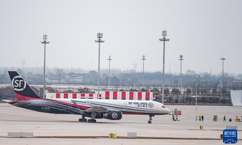 An air freighter taxis at the Ezhou Huahu Airport in Ezhou, central China's Hubei Province, March 19, 2022. The Ezhou Huahu Airport completed its flight-test of air freighter on Saturday. The airport is the country's first cargo airport, with the functional orientation of the air cargo hub and feeder airport for passenger transport. Photo:Xinhua 