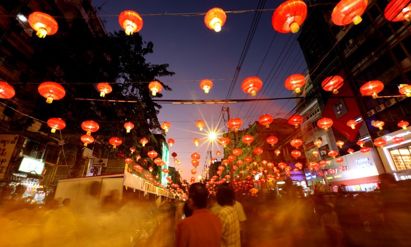 People walk under lanterns during the Chinese Lunar New Year celebration in the Chinatown of Yangon, Myanmar, Jan. 26, 2020.Photo:Xinhua