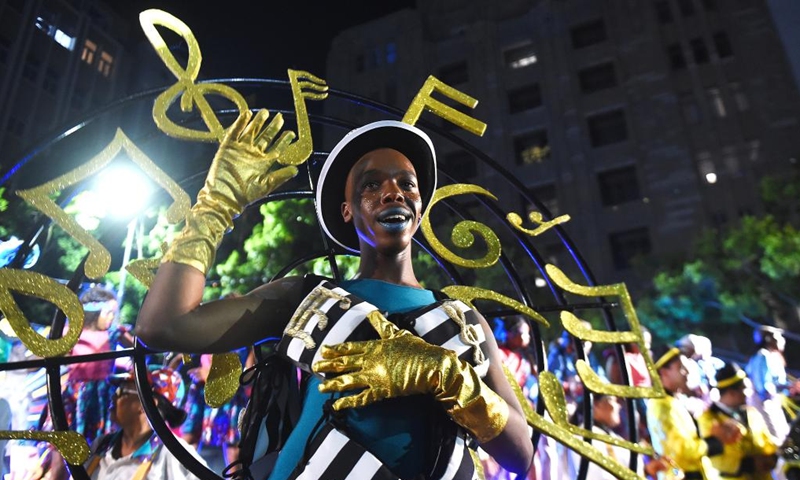 A man performs during the Cape Town Carnival in Cape Town, South Africa, March 19, 2022. The annual Cape Town Carnival returned to the city Saturday in a new form after a two-year break due to COVID-19, while it maintained a tradition of including performers from the Chinese community and many other groups. (Photo by Xabiso Mkhabela/Xinhua)