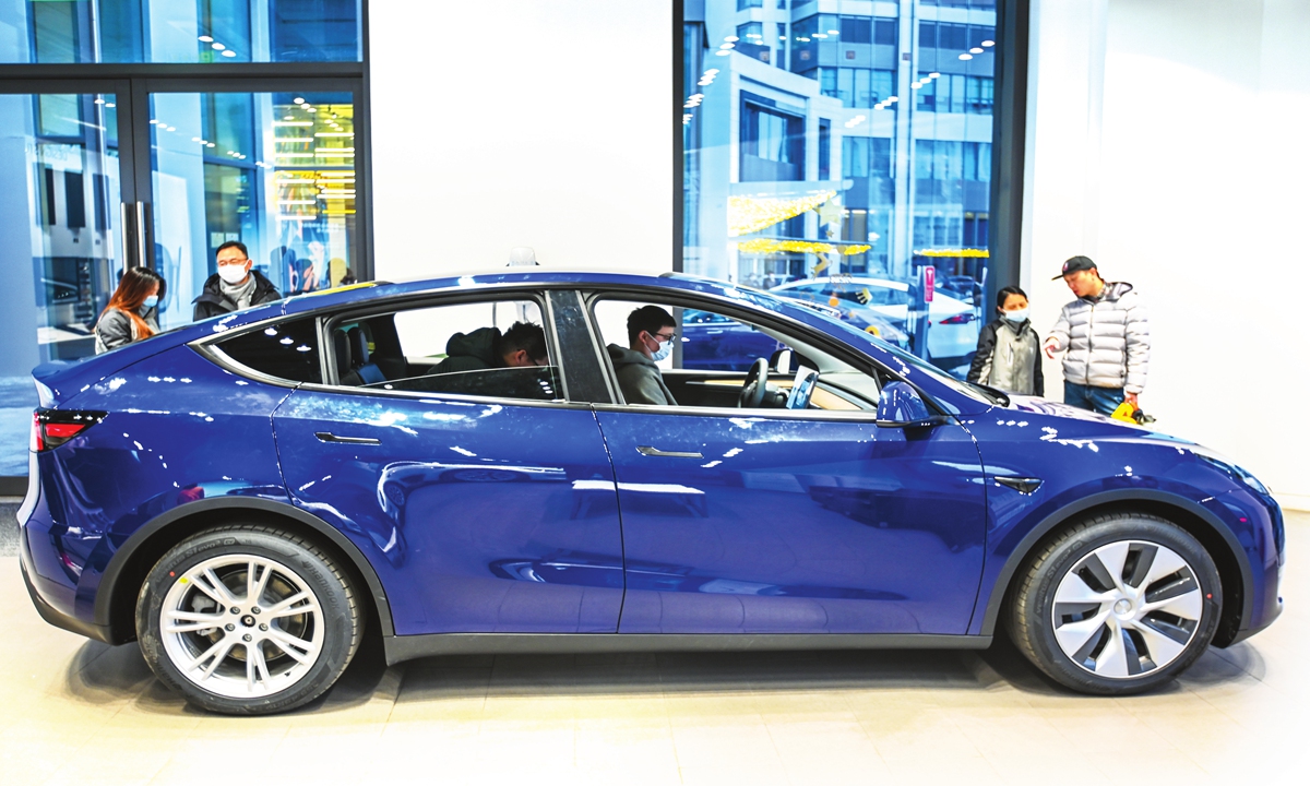 Customers test drive at a Tesla flagship store in Shanghai in January, 2021. Photo:VCG