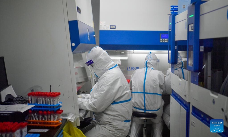 Staff members work at a nucleic testing base in Hebei District of Tianjin, north China, March 19, 2022. The base has a maximum daily testing capability of 15,000 tubes of 150,000 samples. Photo:Xinhua 