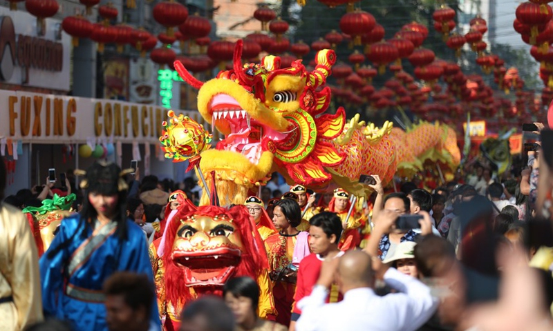 Actors perform dragon and lion dance during the Chinese Lunar New Year celebrations in Chinatown of Yangon, Myanmar, Jan. 25, 2020.Photo:Xinhua