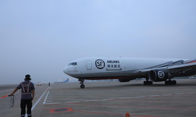 A Boeing 767 freighter carrying 45 tonnes of goods is seen at the Bao'an International Airport in Shenzhen, south China's Guangdong Province, March 19, 2022.Photo:Xinhua