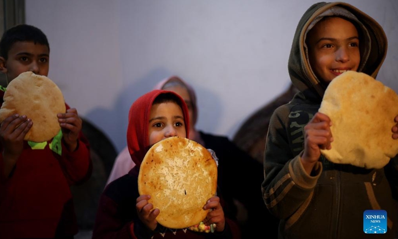 Palestinian refugee children are seen inside their house at Balata refugee camp in the West Bank city of Nablus, March 16, 2022.Photo:Xinhua