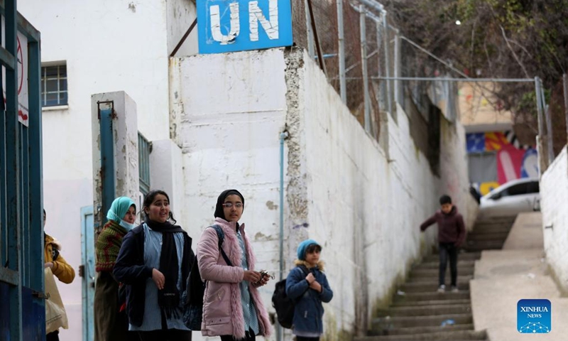 Palestinian refugee students are seen outside a school at Balata refugee camp in the West Bank city of Nablus, March 16, 2022.Photo:Xinhua