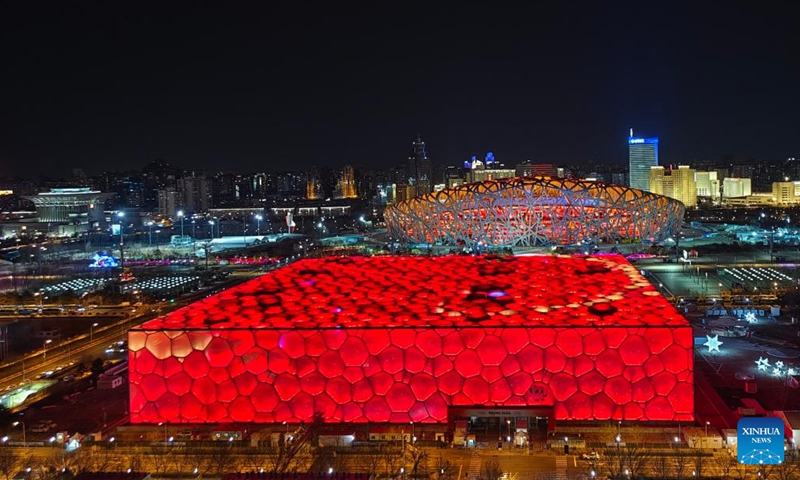 Photo taken with a mobile phone shows the National Stadium, also known as the Bird's Nest, and the National Aquatics Center, also known as the Ice Cube, in Beijing, capital of China, Feb. 4, 2022. (Photo: Xinhua)