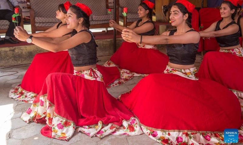 Students perform during an agreement signing ceremony on Chinese language teaching cooperation in Kathmandu, Nepal, March 21, 2022. The Confucius Institute at Nepal's Tribhuvan University signed a memorandum of agreement on Chinese language teaching cooperation with Bal Uddhar Secondary School in Kathmandu of Nepal Monday.(Photo: Xinhua)