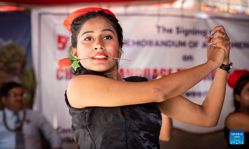 A student performs during an agreement signing ceremony on Chinese language teaching cooperation in Kathmandu, Nepal, March 21, 2022. The Confucius Institute at Nepal's Tribhuvan University signed a memorandum of agreement on Chinese language teaching cooperation with Bal Uddhar Secondary School in Kathmandu of Nepal Monday.(Photo: Xinhua)