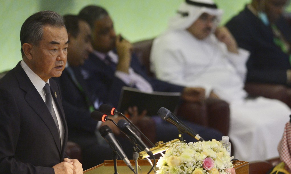 Chinese State Councilor and Foreign Minister Wang Yi (L) speaks during the 48th session of the OIC Council of Foreign Ministers, in Islamabad,Pakistan on March 22, 2022. Photo: AFP