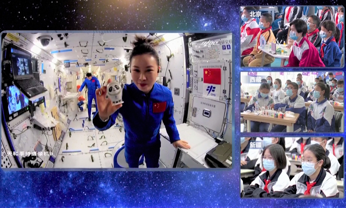 Shenzhou-13 taikonaut Wang Yaping shows Beijing Winter Olympic Games mascot Bing Dwen Dwen during the second live session of the Tiangong classroom lecture series from China's Tianhe space station on March 23, 2022. Screenshots show students from Beijing, Xinjiang Uygur and Xizang autonomous regions watching the live session. Photo: VCG