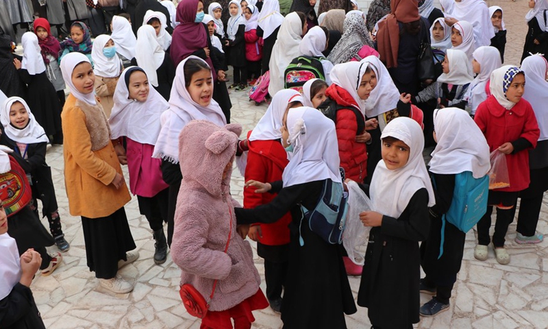 Afghan girls arrive to attend class on the first day of new academic year in Herat city, western Afghanistan, March 23, 2022.(Photo: Xinhua)