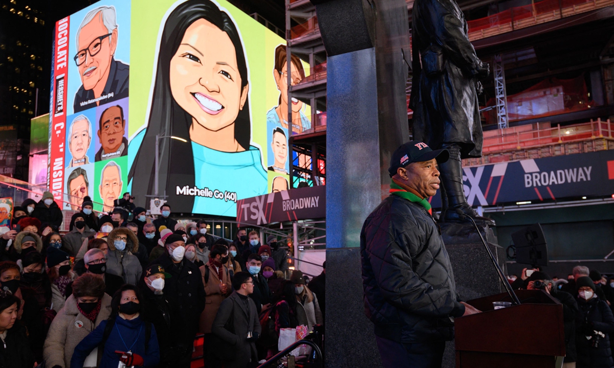 A vigil is held in Times Square, New York on January 18, 2022 in honor of Michelle Go, who was killed after being pushed onto subway tracks on January 15. Anti-Asian hate has been on the rise. Photo: VCG