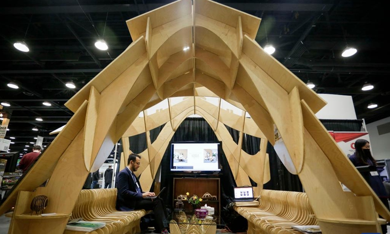 An architectural structure made from plywood panels is displayed during the 2022 BUILDEX show in Vancouver, British Columbia, Canada, on March 23, 2022. As one of Canada's largest conferences and trade shows for building industry, the 2022 BUILDEX Vancouver kicked off on Wednesday, showcasing the latest building materials, products and technologies.(Photo: Xinhua)
