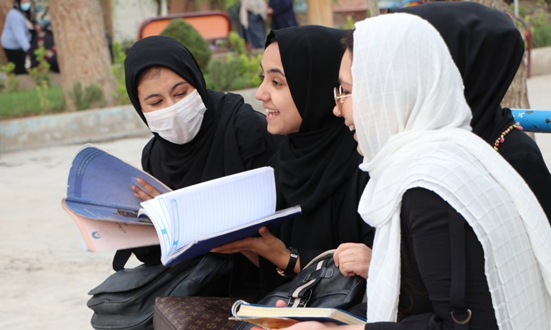 Afghan girls arrive to attend class on the first day of new academic year in Herat city, western Afghanistan, March 23, 2022.(Photo: Xinhua)