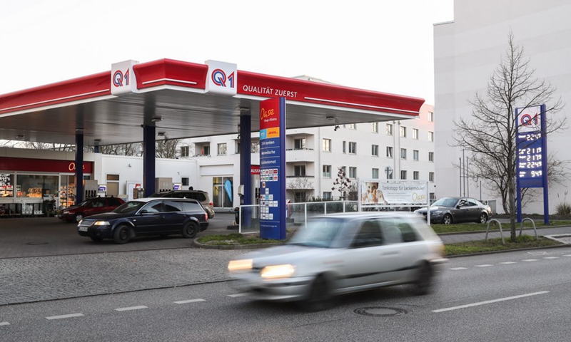 A vehicle runs past a gas station in Berlin, capital of Germany, March 11, 2022.Photo:Xinhua