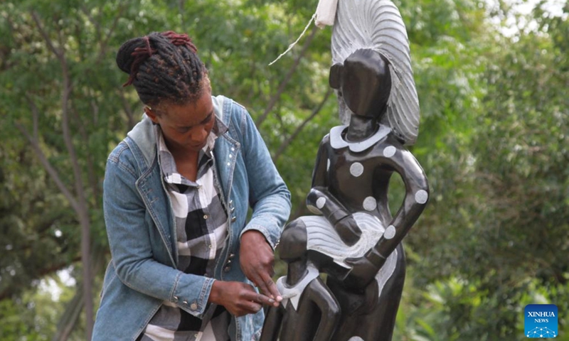 Lorraine Mamvura, an artist focusing on realistic art at Chitungwiza Arts Center, works on an artwork in Chitungwiza, a town south of Harare, Zimbabwe, on March 17, 2022.(Photo: Xinhua)