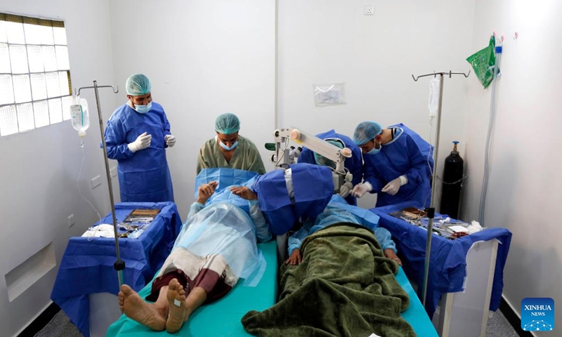 People receive treatment for eye diseases at a charity-sponsored medical center in Sanaa, Yemen, on March 24, 2022. A charity group launched a two-day free treatment for Yemeni elders who are inflicted with eye diseases. (Photo: Xinhua)